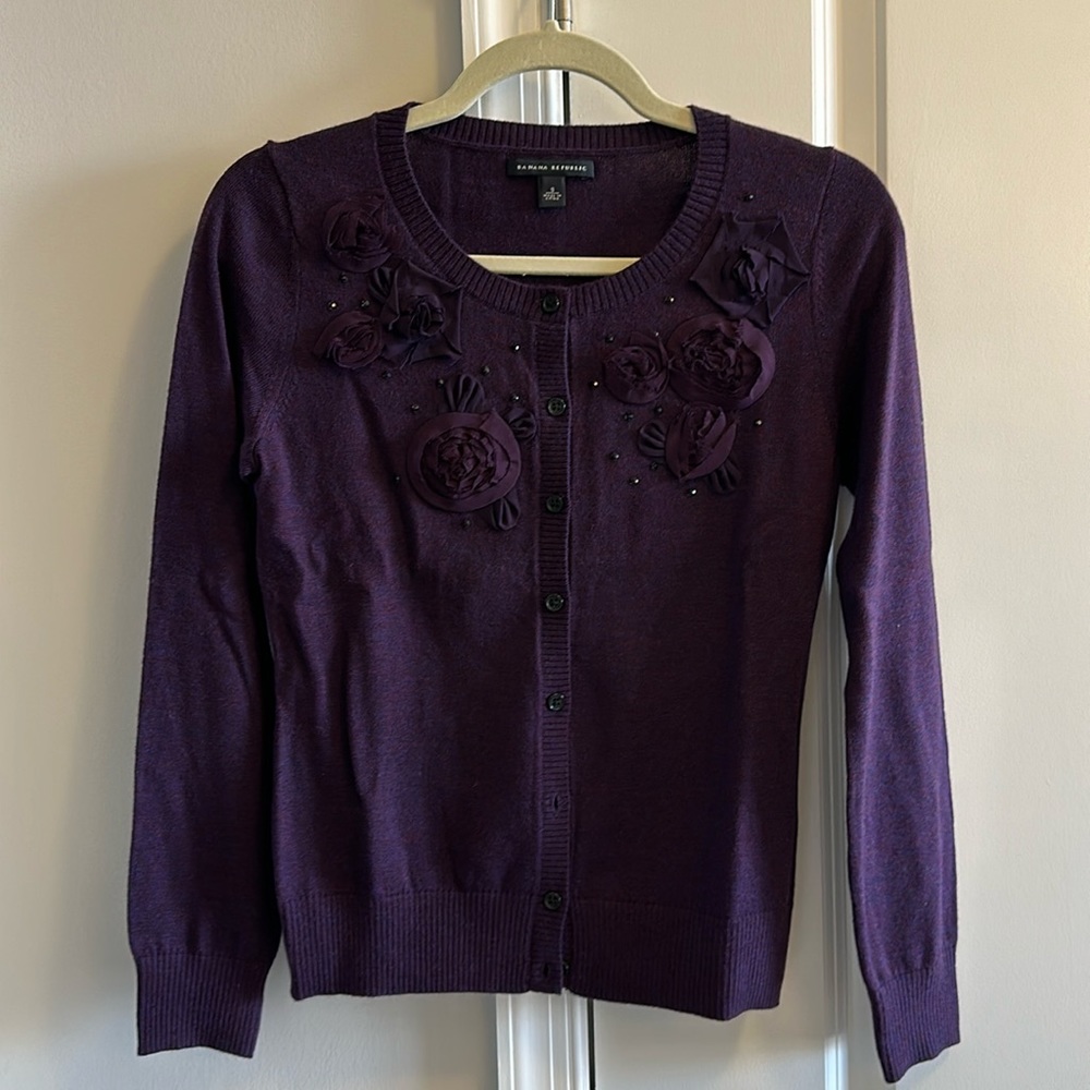 Deep purple cardigan with floral decoration
